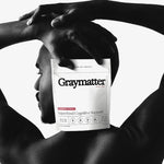 Graymatter Bright Mind superfood cognitive support packaging on model's back.