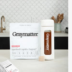 Graymatter Bright Mind Starter Kit with superfood drink mix and bottle.